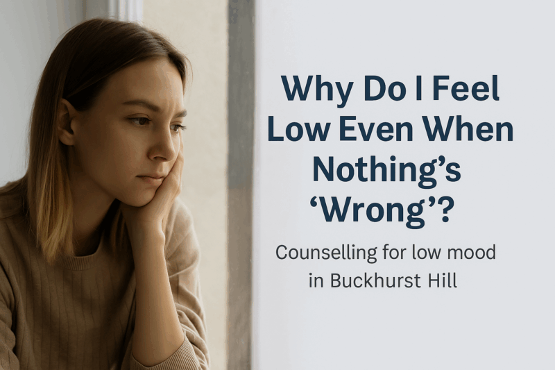 Woman looking out of a window, appearing emotionally low — counselling for low mood in Buckhurst Hill